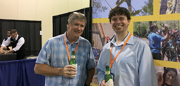 Tom Krastch, head of TRK Creative Group, enjoys a beer with API's Dave Meeker.